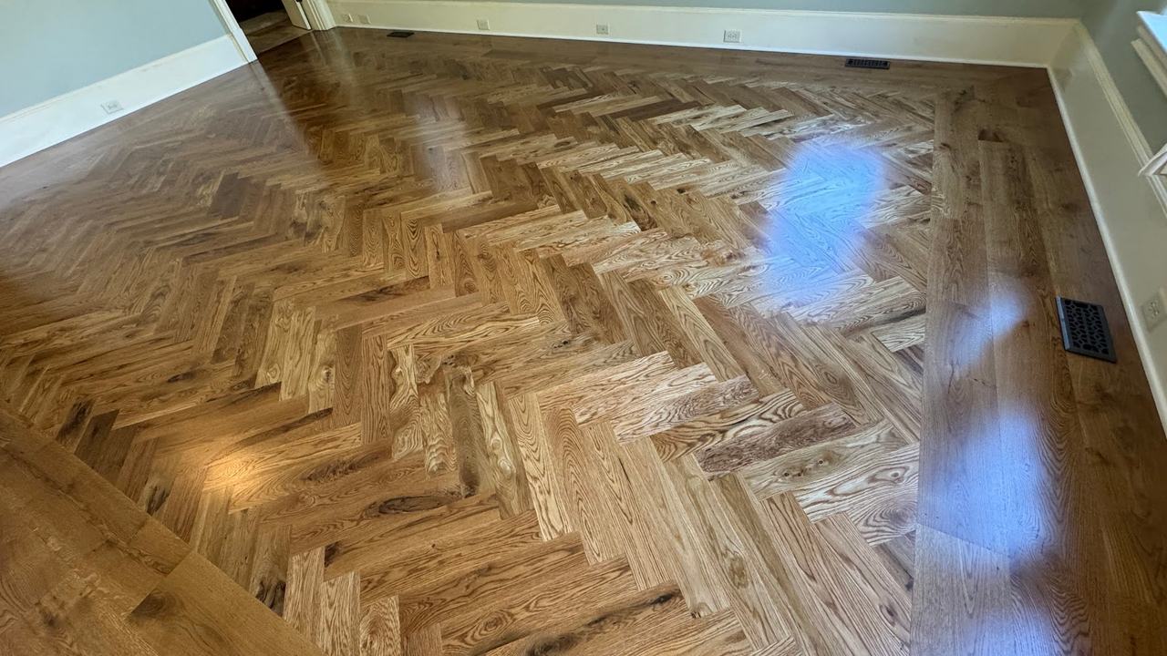 Herringbone hardwood flooring detail in an Alpharetta, GA home