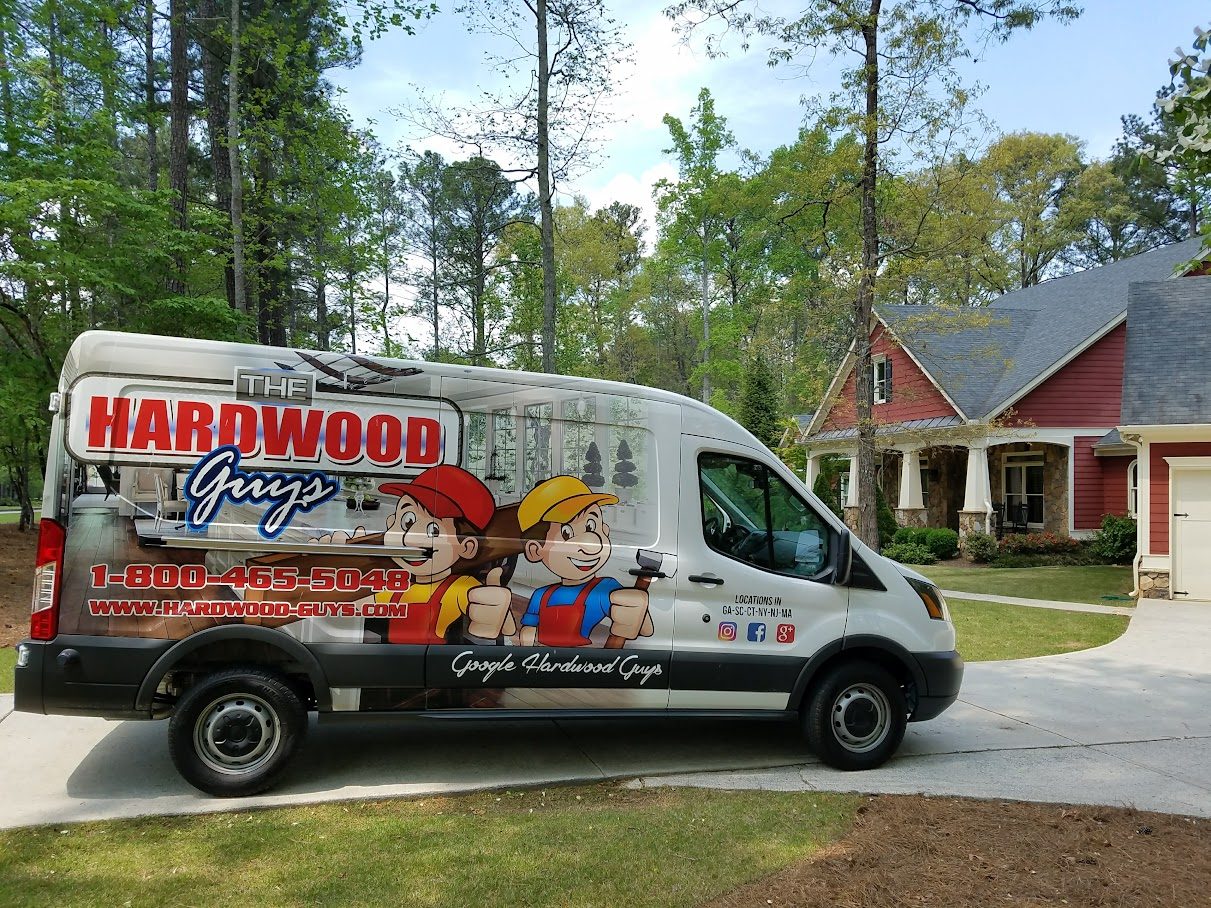 The Hardwood Guys company van parked at a job site in Metro Atlanta