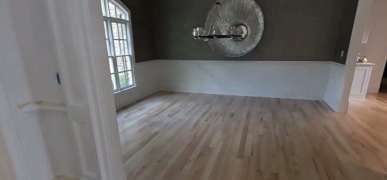 Red oak floor in an East Cobb dining room after Bona Red Out, Natural Seal and Bona Traffic HD