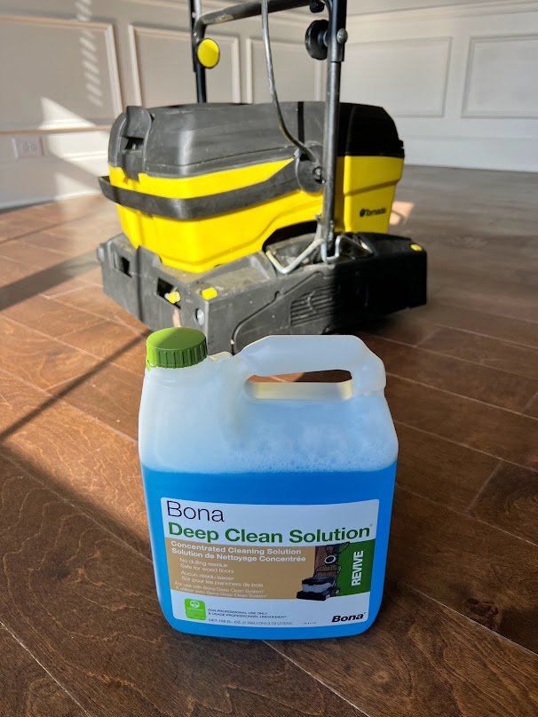 The Hardwood Guys' Tornado floor machine with Bona Deep Clean Solution during a screen-and-recoat