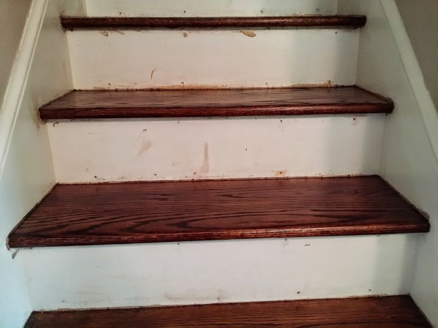 Dark stain marks the white risers during the staining process — this is normal and expected.