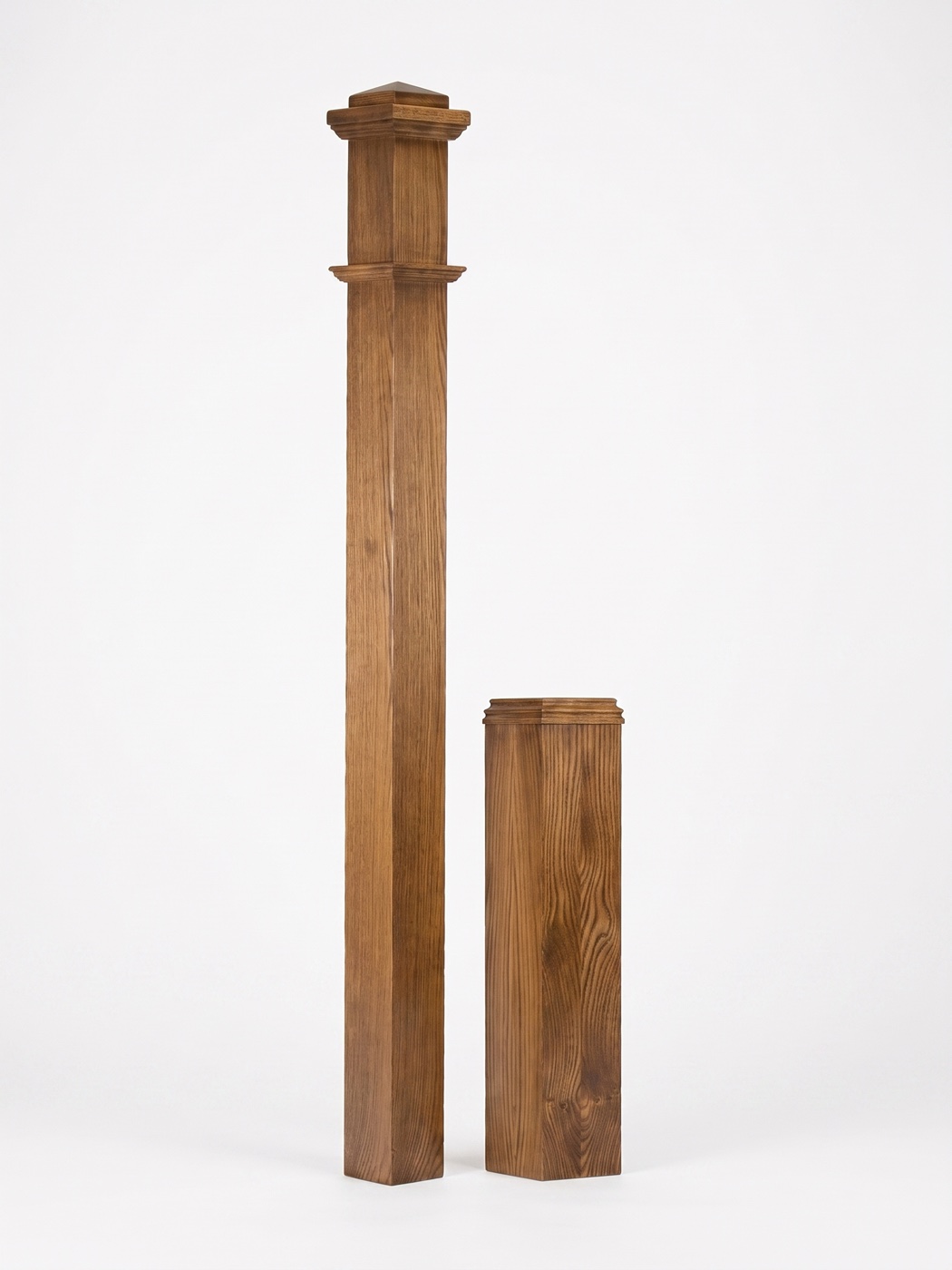 Square newel post shaft beside its separate molded base block