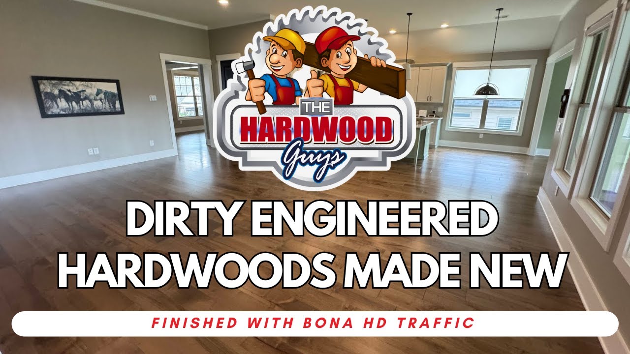 Hazy engineered hardwood floor with glue residue before The Hardwood Guys restored it